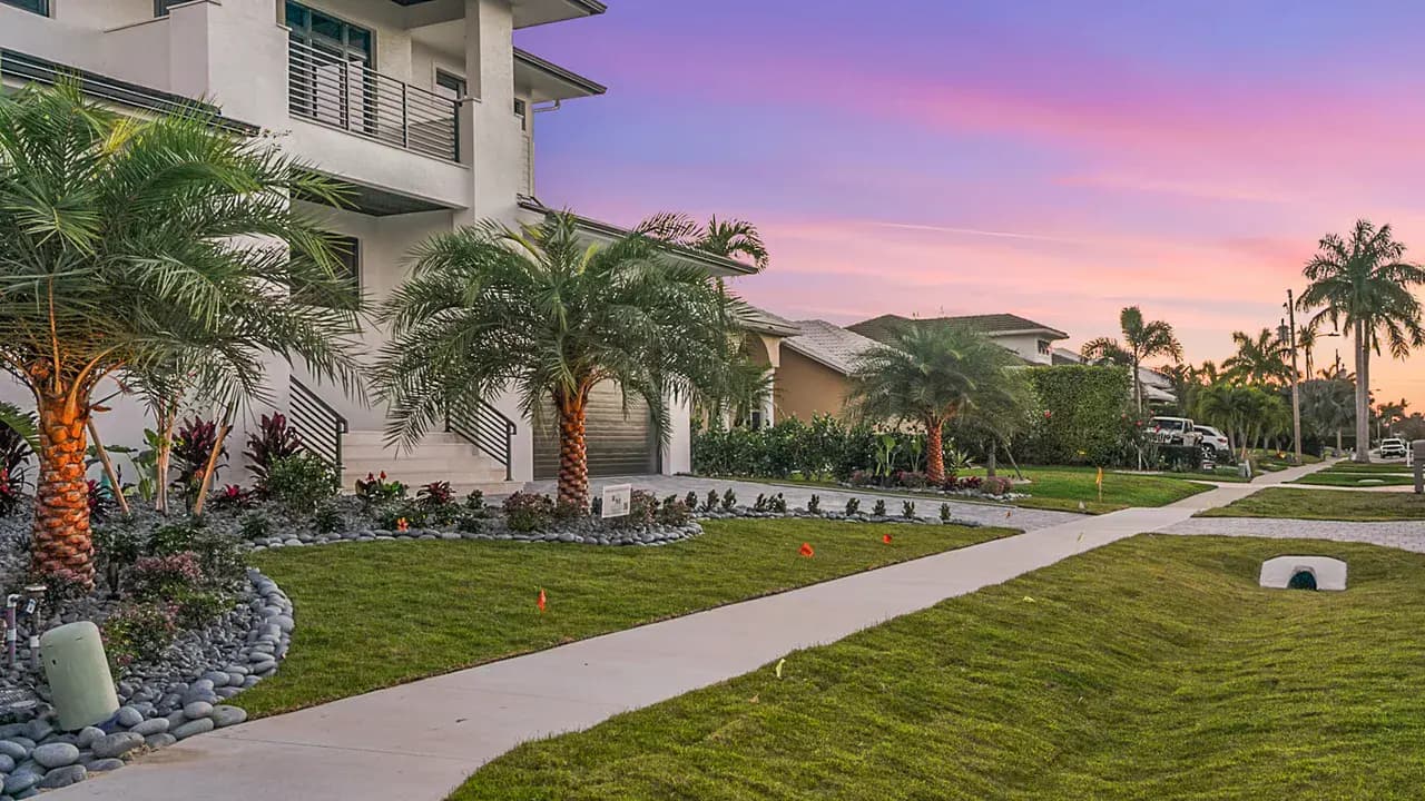 Beautifully landscaped home at twilight